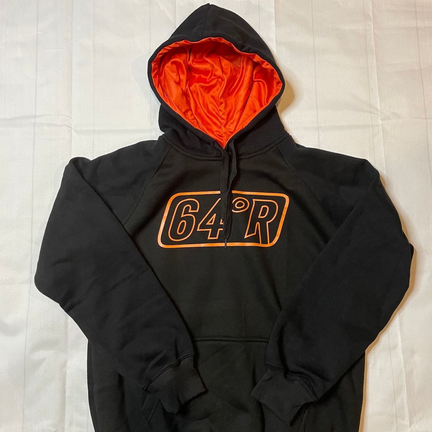 Black hoodie with orange logo